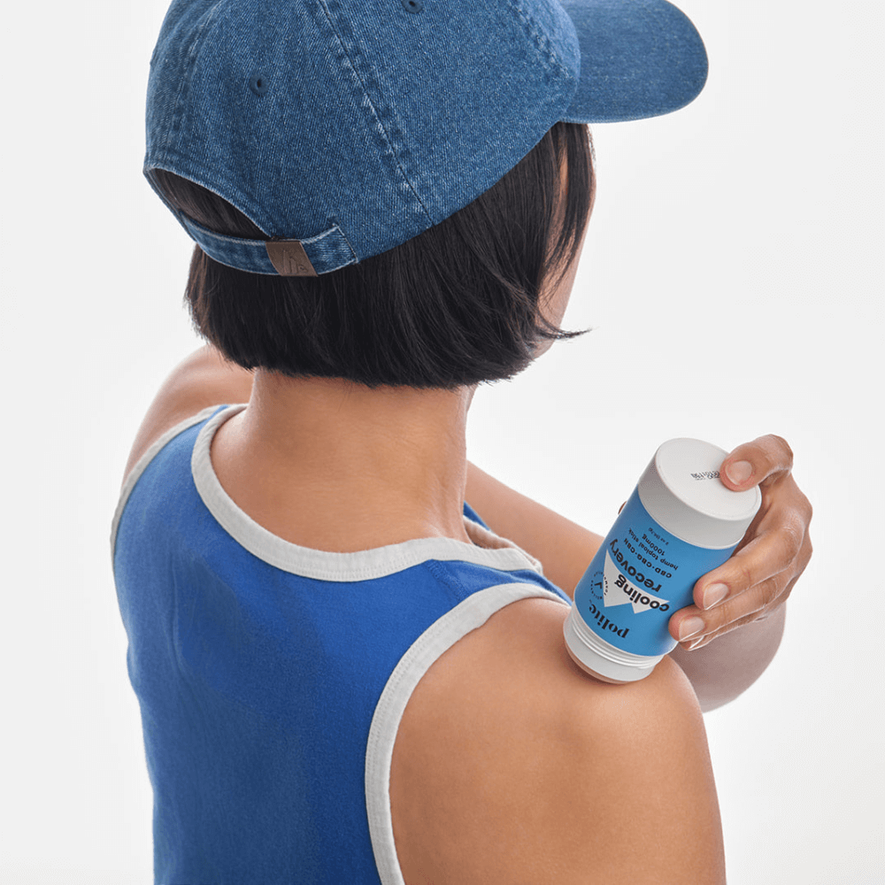 Applying Polite Hemp Cooling Recovery Stick for muscle relief